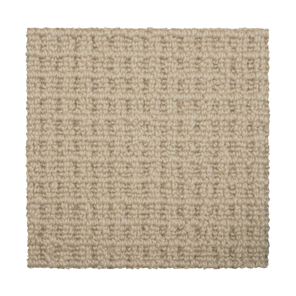 A square swatch of Glen Abbey II Berber Carpet in Thatch, featuring a textured, grid-like looped pattern in light beige against a white background—offering elegant style and comfort for flooring.