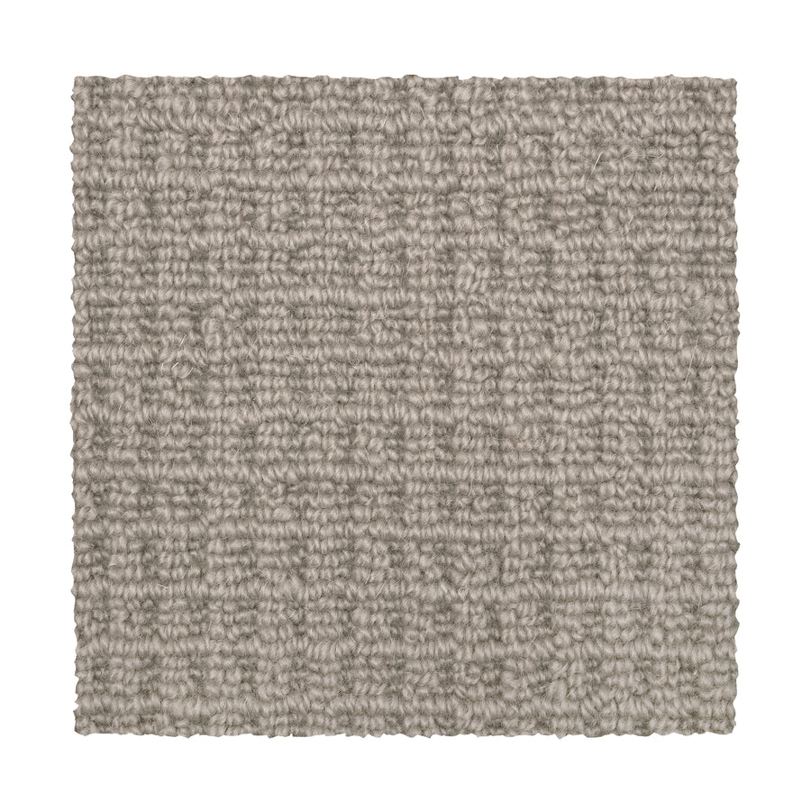 A square swatch of Glen Abbey II Berber Carpet in Ecru, featuring a looped, textured pattern. Displayed on a white background, it's an ideal choice for stylish and durable flooring.