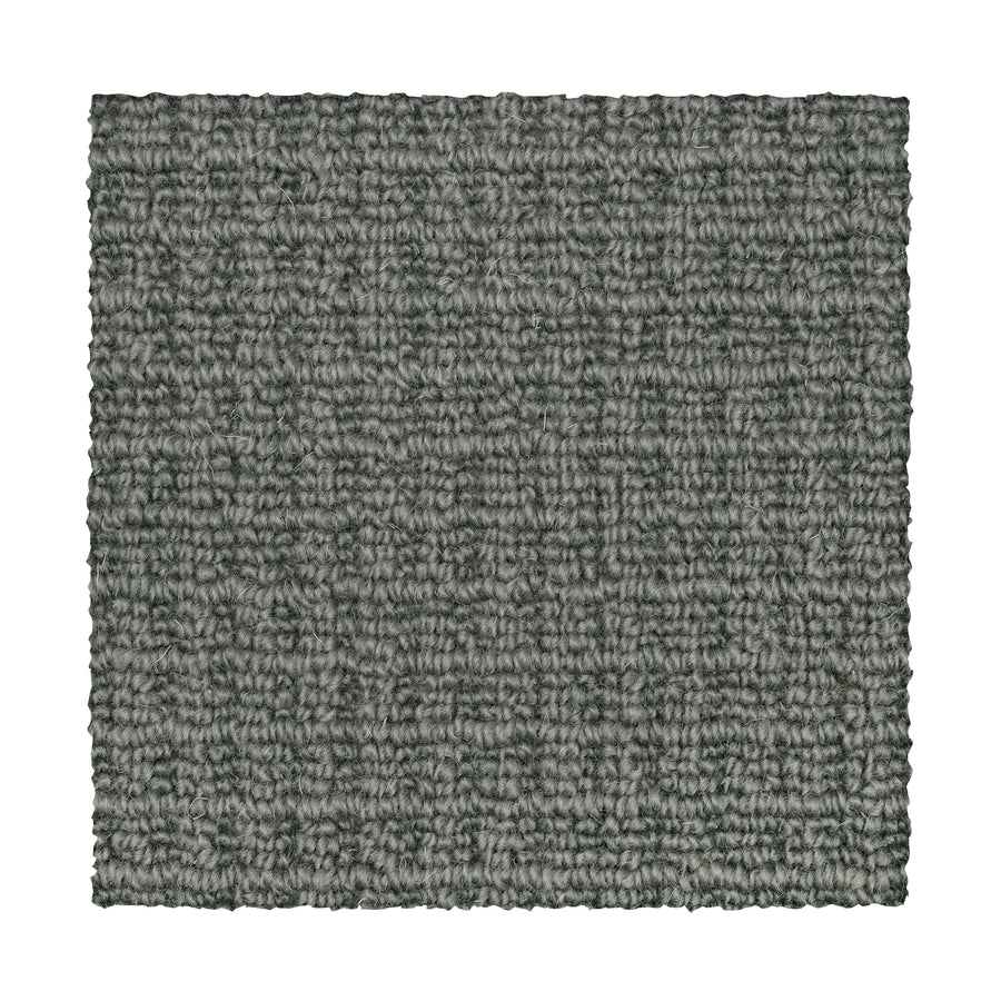 A square sample of Glen Abbey II Berber Carpet in Graphite, featuring a subtle grid-like texture and tightly woven fibers, is shown on a white background—offering a stylish and durable flooring option.