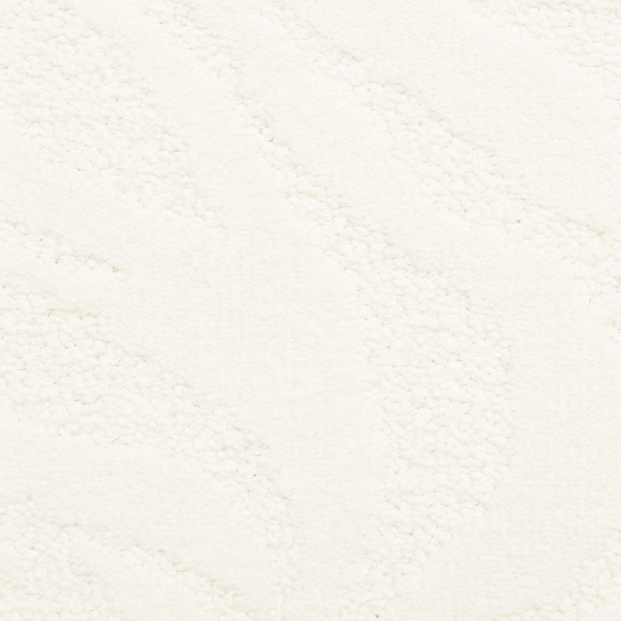 Capetown On Trend Carpet in Good Hope features a textured white surface with subtle, abstract wavy lines. Its minimal, monochromatic look offers a soft, tactile feel—perfect for high-traffic spaces seeking luxurious style.
