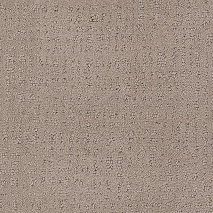 Close-up of the Homage Berber Carpet in Gramercy color, featuring a subtle, irregular grid pattern with soft, raised tufts and gentle shading—luxurious yet perfect for high-traffic areas.