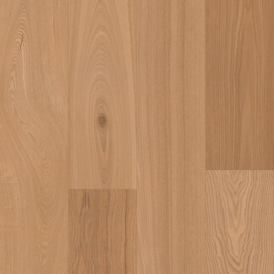 Close-up of Gran Reserva 7 1/2" Hardwood in Barrique, featuring light brown planks with natural grain patterns and subtle color variations, showcasing the elegance of luxury hardwood flooring.
