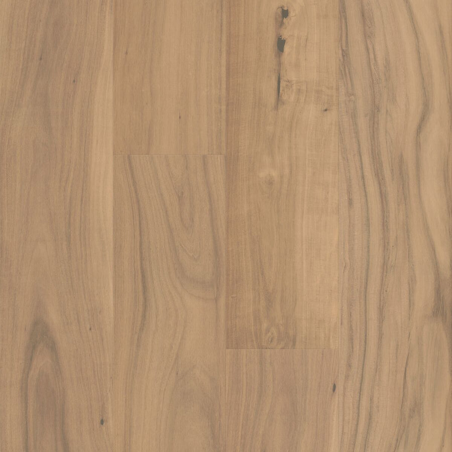 The Gran Reserva 7 1/2" Hardwood in Brix features a light brown color with natural grain patterns and subtle knots. Each smooth, matte-finished plank measures 7 1/2" wide and is arranged side by side to highlight a range of shades and textures, resulting in an elegant look that exemplifies luxury flooring.
