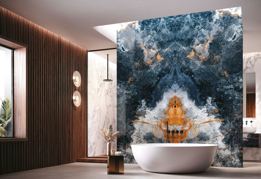 Modern bathroom with a freestanding white tub, striking blue and orange marble accent wall, wooden paneling, large window, and minimalistic decor with natural light streaming in.
