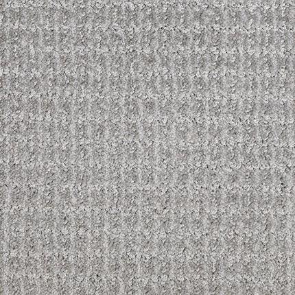 Close-up of Yucatan Pet Friendly Carpet in Grand Gray, showcasing a textured, stain-resistant surface with a subtle grid pattern for style and durability—perfect for pet owners.