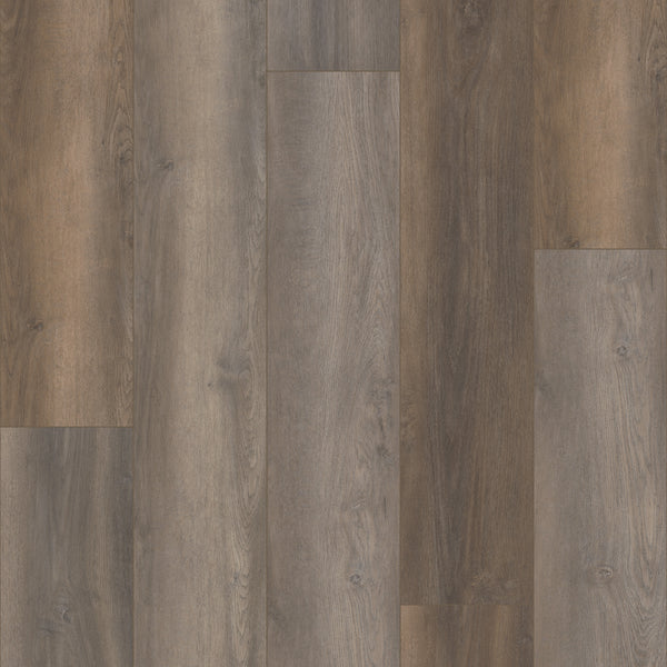 Close-up of Coretec Plus Premium Vinyl flooring planks in varying brown and gray shades, featuring natural wood grain patterns and smooth texture, arranged in a staggered layout.
