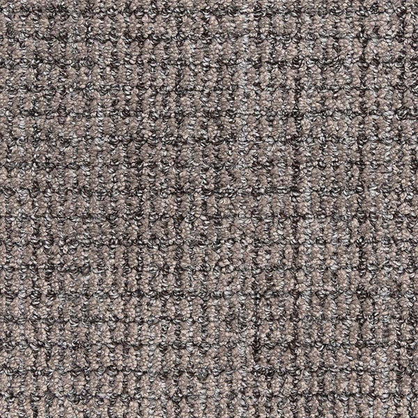 Close-up view of Aspen Berber Carpet in Graphite, featuring a looped, grid-like pattern. Its durable fibers give the surface a subtle checkered look.