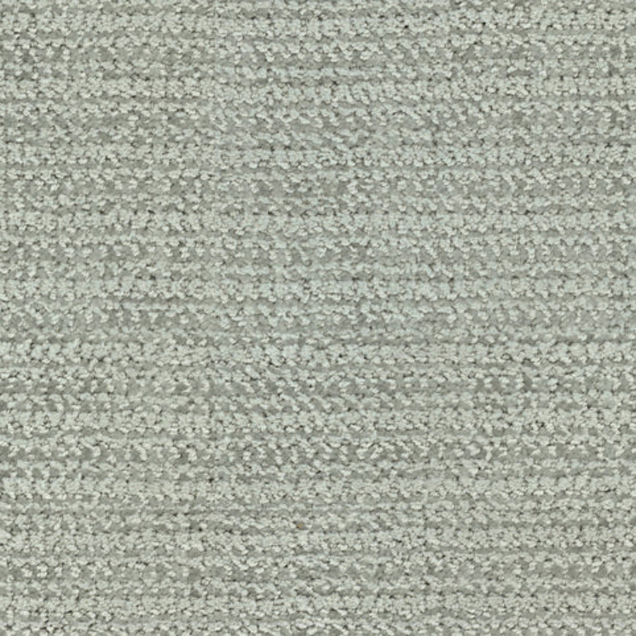 Close-up of the Beguiling Berber Carpet in Green Tea, featuring a light green, textured surface with a subtle woven pattern and horizontal lines that give this premium carpet a soft, looped appearance.