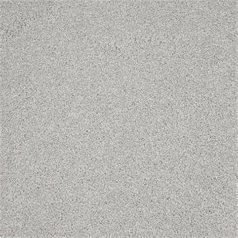 A close-up of Harbor Town Family Friendly Carpet in Gull shows its light gray, finely textured surface—offering a durable, stain-resistant, family-friendly option with the look of even, granular sand or concrete.