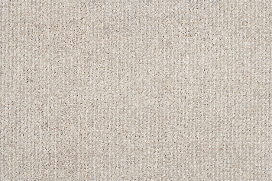 Close-up of Henderson On Trend Carpet in Champagne. This luxurious carpet features a soft, textured woven pattern with subtle grid-like design, highlighting its premium construction and slight yarn variations.