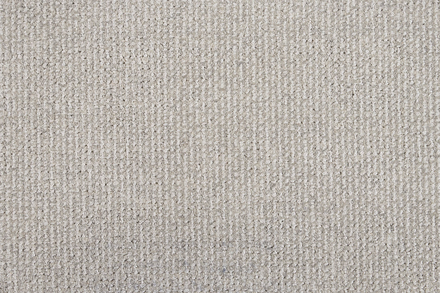 Close-up view of the Henderson On Trend Carpet in Vista, showcasing its textured surface, grid-like pattern, premium construction, and subtle thread color variations.