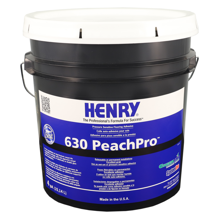A large black bucket with a white lid labeled Henry 630 PeachPro, a pressure sensitive flooring adhesive ideal for carpet tile applications, featuring product details and branding on the front.