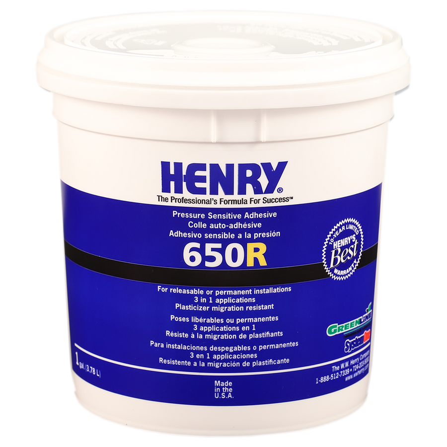 A white plastic tub labeled Henry 650 R with blue and white branding contains a 1-gallon (3.78 L) acrylic polymer adhesive, moisture resistant and ideal for releasable flooring applications.