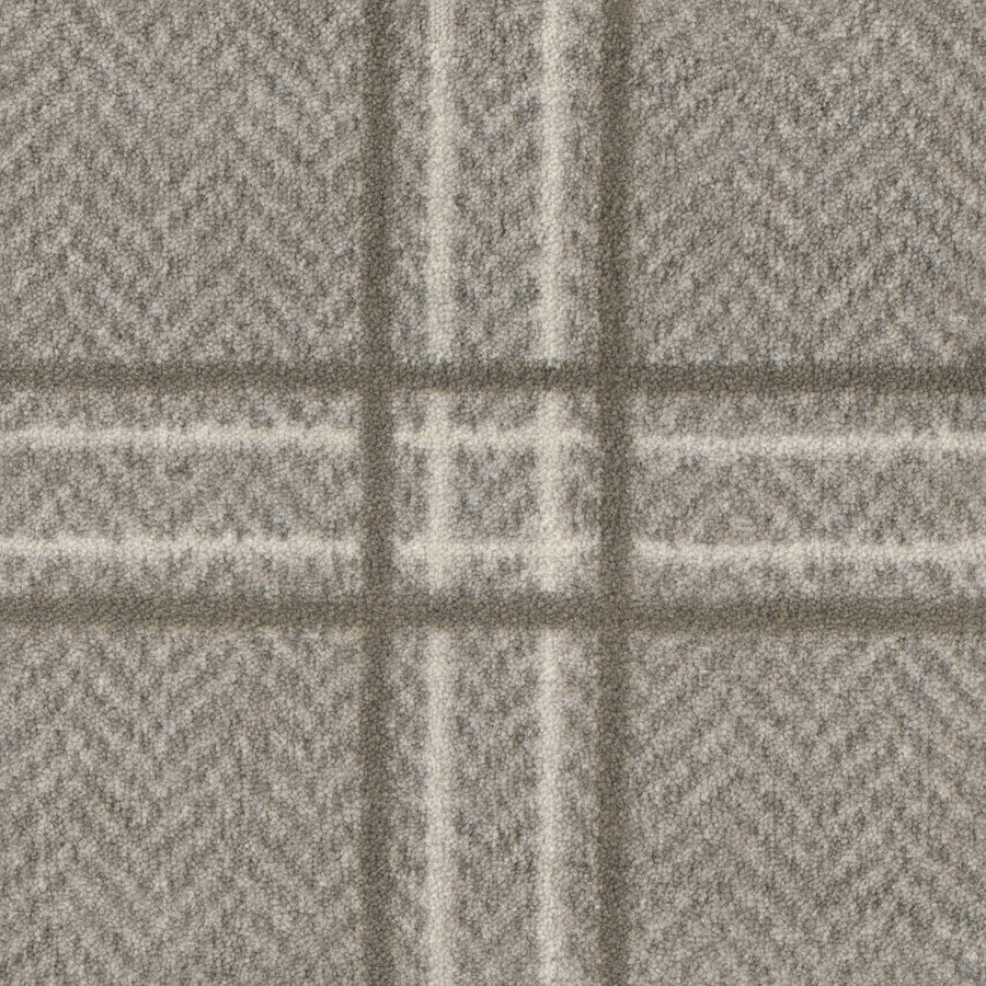 Close-up of Herrington On Trend Carpet in Fossil—a soft, textured fabric with gray and white plaid and subtle herringbone design, perfect for contemporary spaces or as a luxury carpet for high-traffic areas.