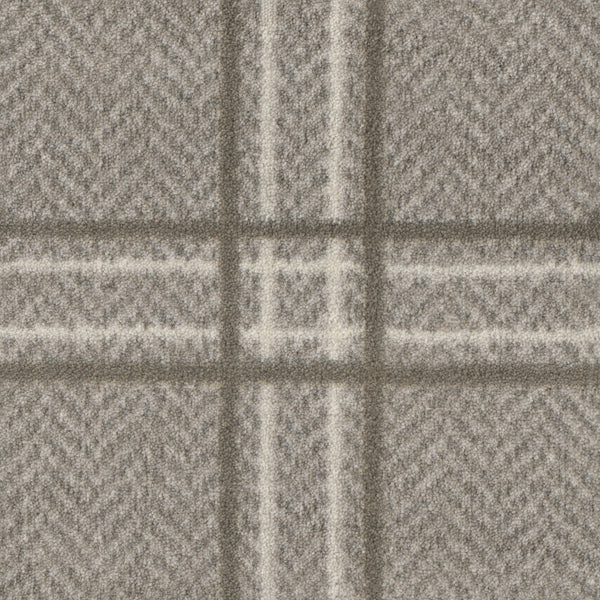 Close-up of Herrington On Trend Carpet in Fossil—a soft, textured fabric with gray and white plaid and subtle herringbone design, perfect for contemporary spaces or as a luxury carpet for high-traffic areas.