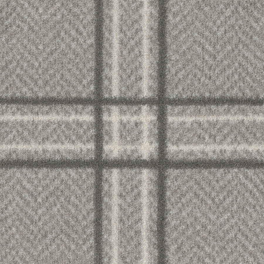 Close-up of Herrington On Trend Carpet in Grey Fell—a durable wool with herringbone texture and large plaid, perfect for luxury contemporary spaces or high-traffic areas.
