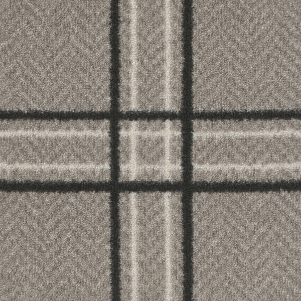 A close-up of Herrington On Trend Carpet in Blackwed shows grey fabric with a plaid pattern, thick black and thin white lines forming large squares, and a subtle herringbone design—perfect for contemporary, high-traffic luxury spaces.