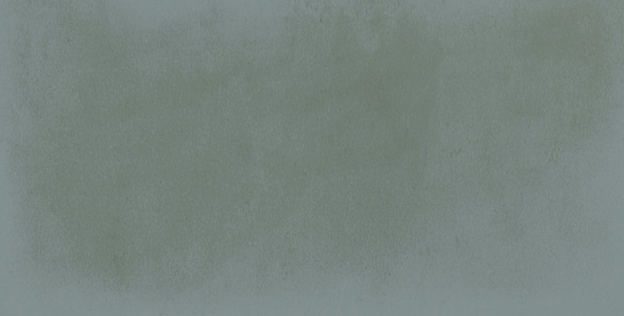 The Harmony 2.5x5 Porcelain Tile features a textured, dusty blue-green background with gentle shading variations, evoking the soft, slightly mottled look of handmade tile.