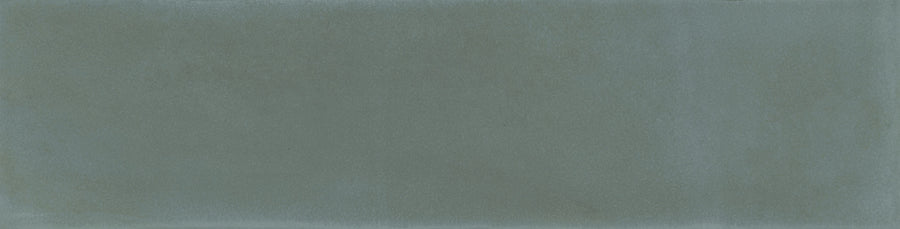 The Harmony 2.5x10 Porcelain Tile features a textured, rectangular surface in teal and blue tones with a soft, mottled look that echoes the artisanal charm of handmade tiles.