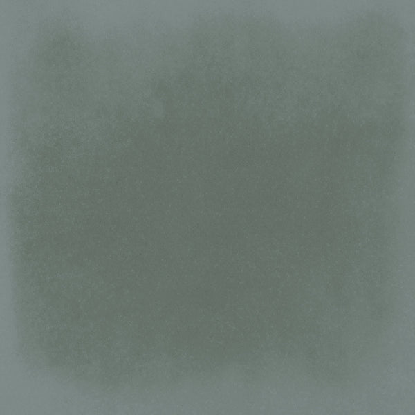 A green square tile, the Harmony 5x5 Porcelain Tile in Emerald, features a unique design.