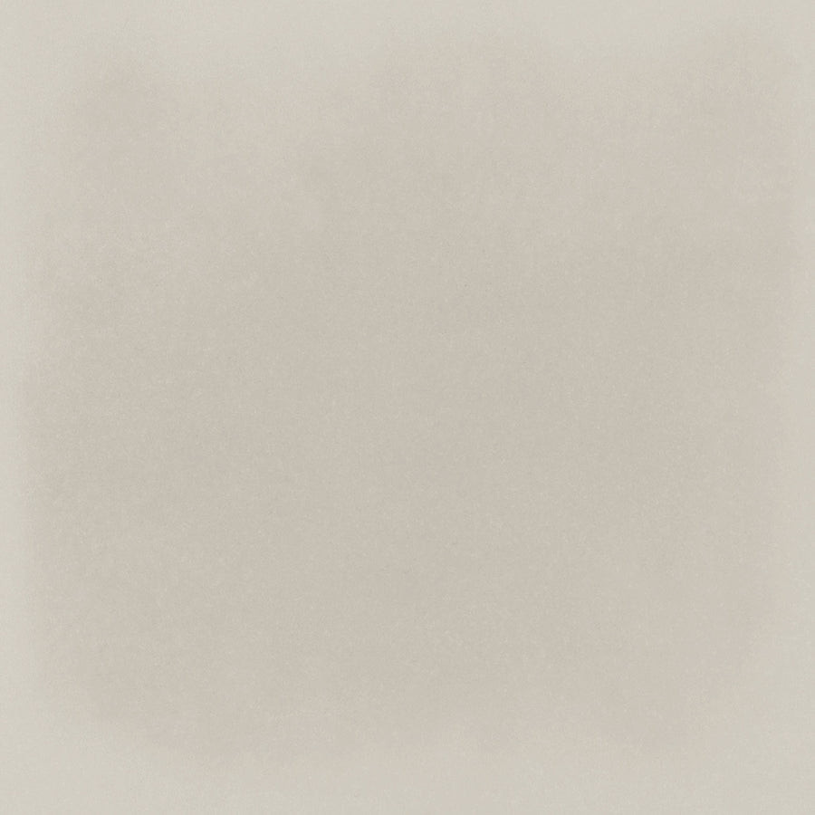 The Harmony 5x5 Porcelain Tile in Pebble features a textured light beige surface with a subtle grainy pattern, evoking the look of handmade tile and softly speckled paper.