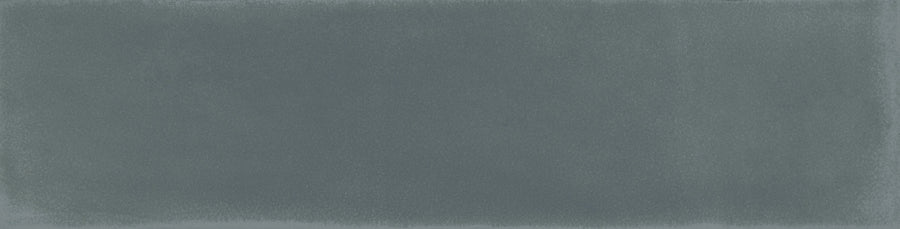 The Harmony 2.5x10 Porcelain Tile features a textured blue surface with a gentle gradient and soft, irregular edges, creating a handmade look that evokes painted or watercolor artistry.