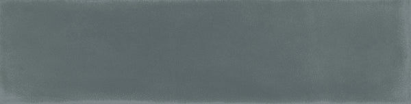 The Harmony 2.5x10 Porcelain Tile features a textured blue surface with a gentle gradient and soft, irregular edges, creating a handmade look that evokes painted or watercolor artistry.