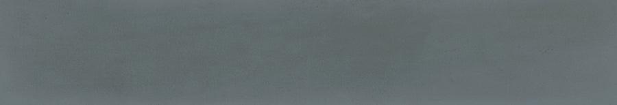 The Harmony 2.5x15 Porcelain Tile features a textured, solid blue-gray background with subtle shade variations, resembling handcrafted tile or concrete.