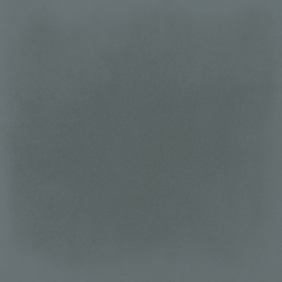 The Harmony 5x5 Porcelain Tile in Marine features a textured blue surface with a darker, subtly cloudy center and lighter edges, evoking the look of handmade tile with a soft vignette effect.