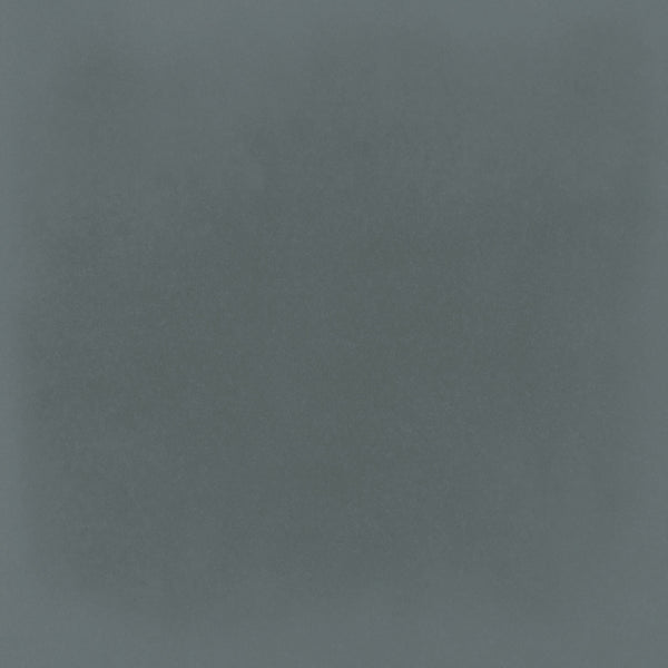 The Harmony 5x5 Porcelain Tile in Marine features a textured blue surface with a darker, subtly cloudy center and lighter edges, evoking the look of handmade tile with a soft vignette effect.