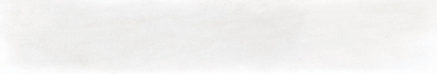 Harmony 2.5x15 Porcelain Tile features a blank white textured surface with faint gray speckles, evoking the look of handmade tile or a lightly textured wall.