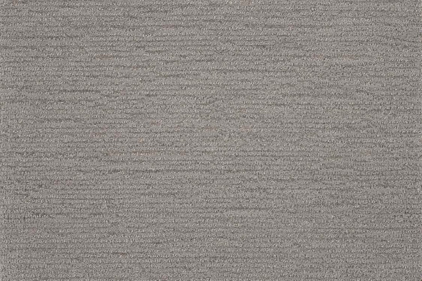 Close-up of Highlands Berber Carpet in Canyon, featuring a textured surface with a subtle horizontal weave and fine threads. This contemporary flooring offers stylish shading variations and a comfortable feel underfoot.