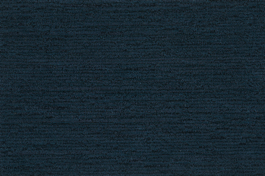 Highlands Berber Carpet in Inkwell features a dark blue, subtly mottled texture with horizontal lines, creating a soft, woven look—perfect for contemporary flooring that’s both stylish and comfortable underfoot.