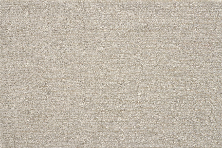 Close-up of Highlands Berber Carpet in Plateau—a beige, textured carpet with a subtle horizontal weave. Its soft, uniform surface makes it a stylish and comfortable choice for contemporary flooring.