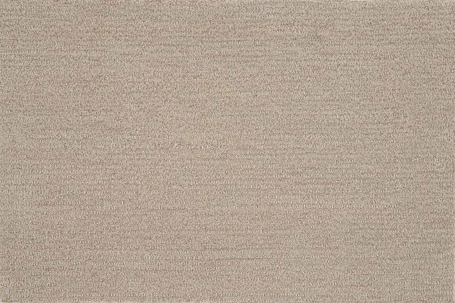 Close-up view of Highlands Berber Carpet in Prairie, featuring a soft, textured surface with subtle horizontal lines. This durable carpet offers comfort underfoot and a warm, neutral style perfect for modern homes or offices.