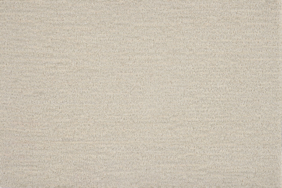 A close-up view of Highlands Berber Carpet in Yukon shows its beige, textured fabric with a subtle horizontal woven pattern—comfortable underfoot and ideal for contemporary flooring with a natural, neutral look.