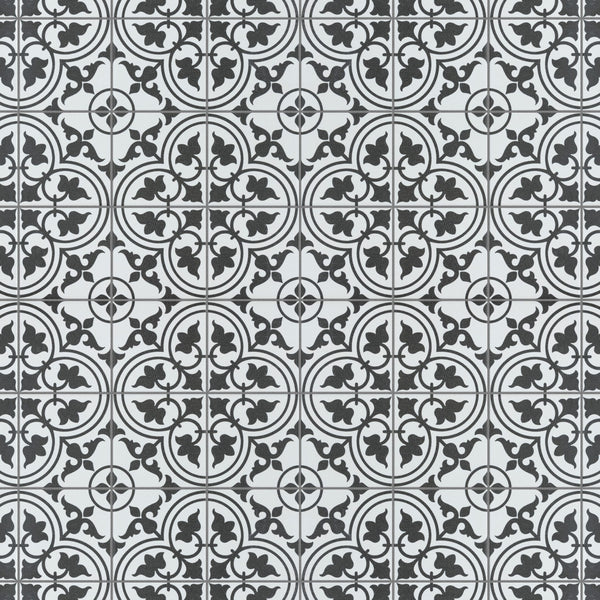 Black and white patterned tiles featuring repeating circular floral and geometric designs, creating a symmetrical and intricate mosaic effect across the surface.