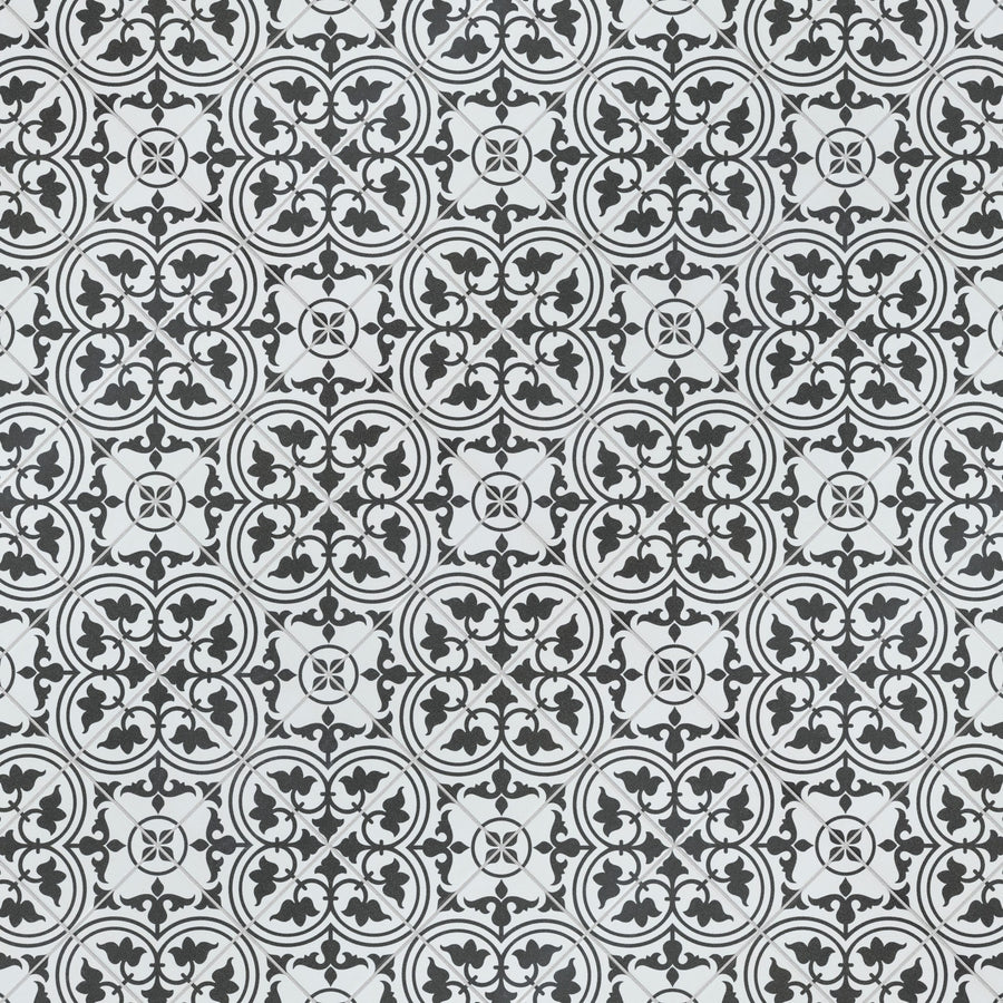 Black and white repeating tile pattern with intricate circular and floral motifs, creating an ornate and symmetrical geometric design.