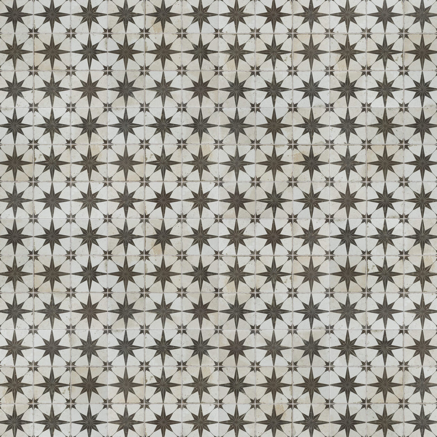 A repeating geometric pattern of black and gray eight-pointed stars on a light background, creating a tiled, symmetrical design.