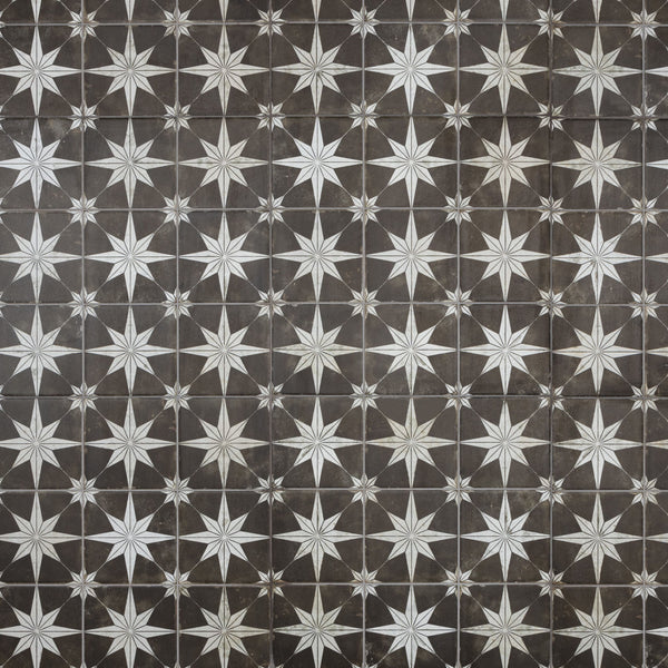 A repeating geometric pattern of white eight-pointed stars on a dark brown tiled background, creating a symmetrical and visually striking design.