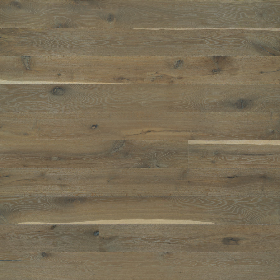 Close-up of Provincetown 7 1/2" White Oak Hardwood planks featuring a natural brown finish, visible knots, and rich grain patterns that highlight the unique shades and textures of European White Oak.