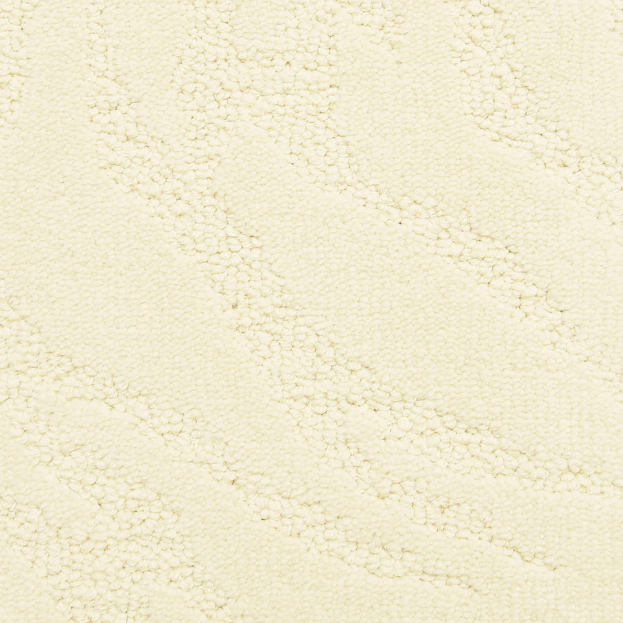Close-up of Capetown On Trend Carpet in Hermanus—cream-colored with a subtle wavy pattern and small raised dots. Its textured, soft surface is ideal for high-traffic areas.