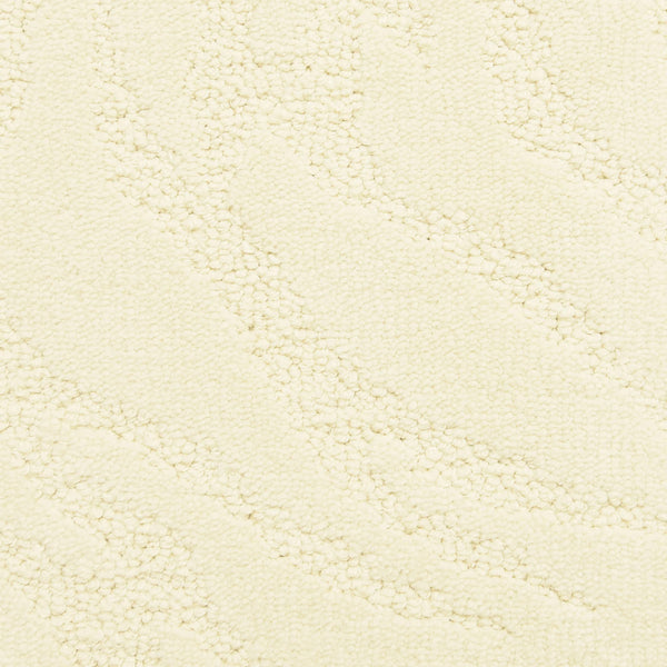 Close-up of Capetown On Trend Carpet in Hermanus—cream-colored with a subtle wavy pattern and small raised dots. Its textured, soft surface is ideal for high-traffic areas.