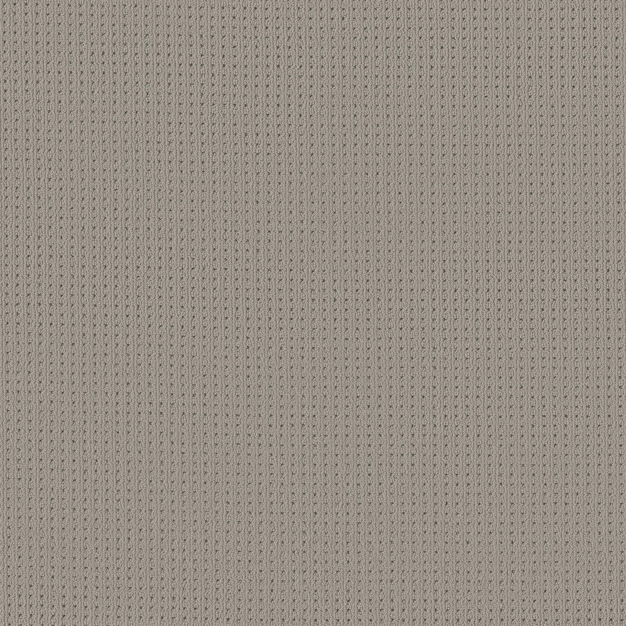 Close-up of San Lucas Family Friendly Carpet in Huskie—a beige, vertical ribbed knit with textured interlocking loops, perfect for high-traffic homes seeking cozy durability.