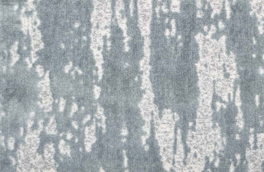 Arabella On Trend Carpet in Ice features an abstract pattern of vertical gray and white streaks, delivering a timeless, elegant look reminiscent of watercolor or melting ice for any sophisticated space.