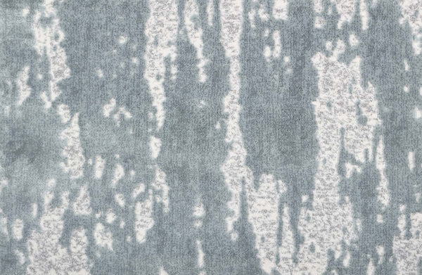 Arabella On Trend Carpet in Ice features an abstract pattern of vertical gray and white streaks, delivering a timeless, elegant look reminiscent of watercolor or melting ice for any sophisticated space.