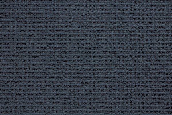 Close-up of the Sequoia Berber Carpet in Indigo, featuring a tightly woven, horizontal striped texture. Made from premium fibers, it offers a soft, uniform look that's perfect for high-traffic areas.