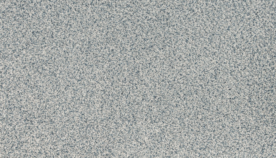 A close-up of the Innovative Comfort I Pet Friendly Carpet in Waterfall shows a textured, speckled gray and white pattern—ideal for modern spaces seeking stain-resistant, pet-friendly durability.