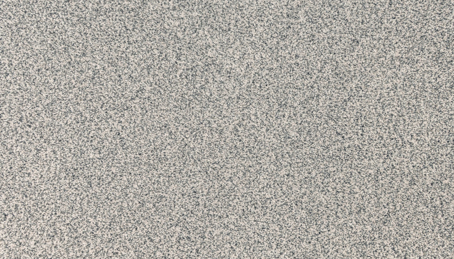 Close-up of the Innovative Comfort I Pet Friendly Carpet in Starlash, featuring a dense, speckled gray and white pattern that resembles static noise or granite—ideal for a high-end, stain-resistant flooring look.