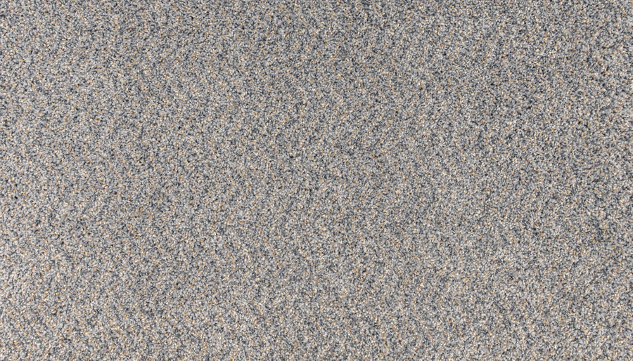 A close-up of the Innovative Comfort III Pet Friendly Carpet in Salute shows its textured, speckled gray surface—ideal for luxury spaces needing style, durability, and stain resistance.